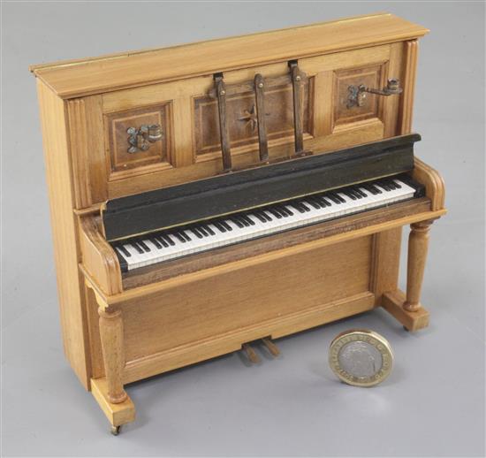 Denis Hillman. A Victorian style walnut miniature upright piano, width 5in.